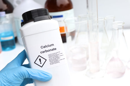 Calcium carbonate in bottle, chemical in the laboratory and industry, Chemicals used in the analysisの写真素材