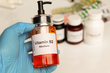 Vitamin B2 pills in a bottle, food supplement for health or used to treat diseaseの写真素材
