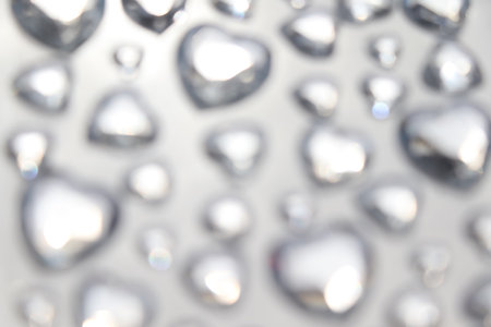 Heart shape blur, card and bokeh on background, valentine's day backgroundの写真素材