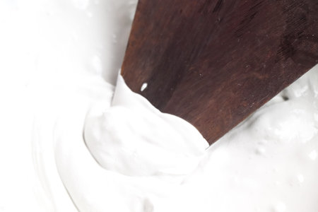 mixing grout in a bucket for mechanic work or repairの写真素材