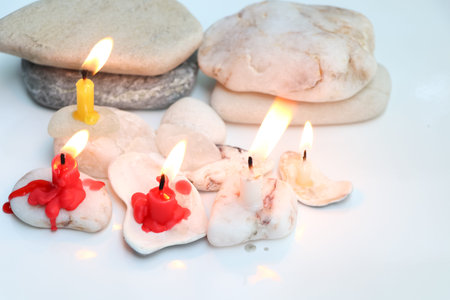 Candle light in the day, Candle light on white background and stoneの写真素材