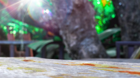 Empty wooden table with lights bokeh on blur nature background, table wood for product display...