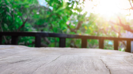 Empty wooden table with lights bokeh on blur nature background, table wood for product display templateの写真素材