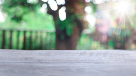 Empty wooden table with lights bokeh on blur nature background, table wood for product display templateの写真素材