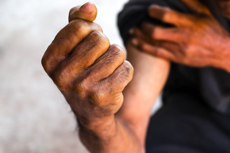 Hand of Asian elderly arm showing power strong, senior and strong hand