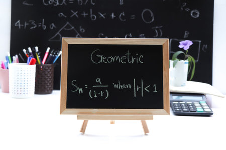 Blackboard with hand written Sequences and Series Formulas and geometric shapes and figures