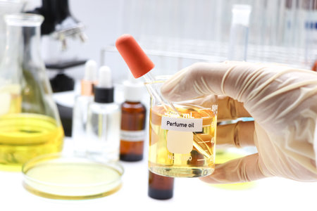 Perfume oil in Glass Bottle, yellow Perfume oil, bottles of perfume on backgroundの写真素材
