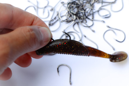 close up shot of fish hook on white background, and sharp
