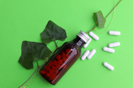 herbal pills or vitamins and green leaf, bio supplement, eco friendlyの写真素材