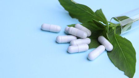 herbal pills or vitamins and green leaf, bio supplement, eco friendly