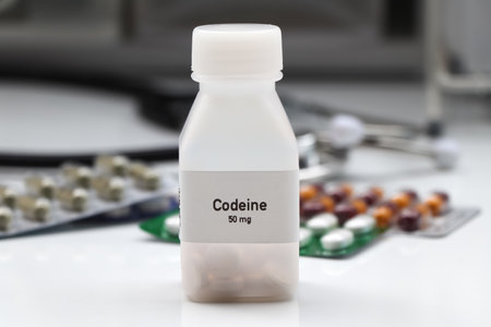 codeine pill in white bottle, pill stock, medical or pharmacy conceptの写真素材