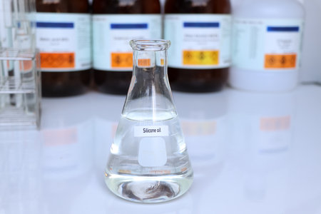 Silicone oil in container, chemical analysis in laboratory, chemical raw materials in industryの写真素材