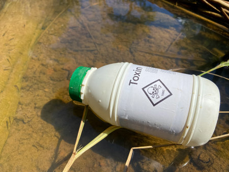 The toxic symbol on chemical container and nature background, Hazardous chemicals destroy the...