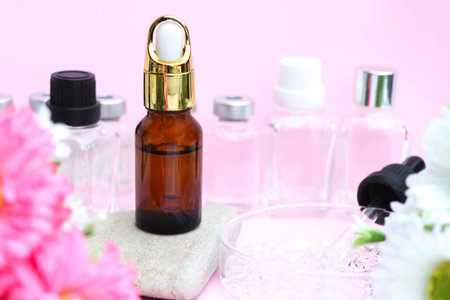 beauty product, Substances used for treatment  or medical beauty enhancement, flower and pink backgroundの写真素材