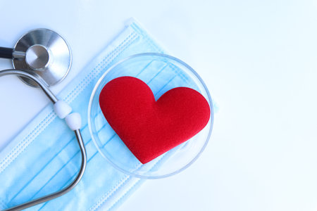 Red cloth heart with the concept of love and healthの写真素材