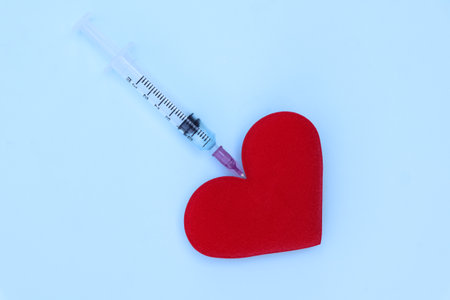 Red cloth heart with the concept of love and healthの写真素材