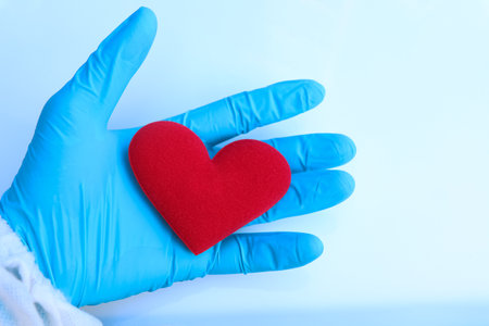 Red cloth heart with the concept of love and healthの写真素材