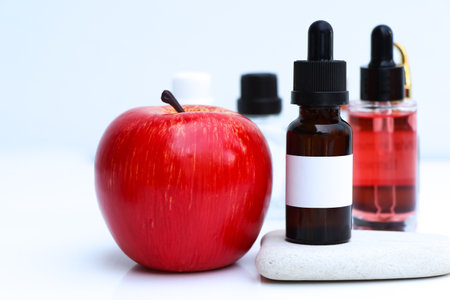 Apple Extract, Fruit extracts are used in cosmetics or health product, white backgroundの写真素材