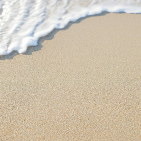 Soft wave of the sea on the sandy beach. Summer background.の写真素材