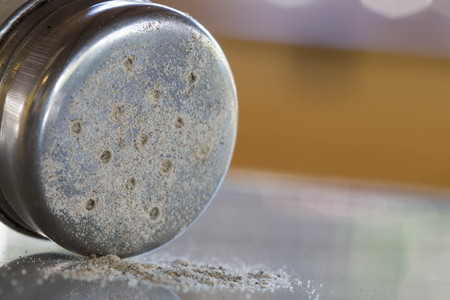 Close-up Pepper Shaker on a marble tableの写真素材