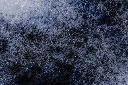 close-up foam bubbles on a black background with copy space texture. Abstractの写真素材