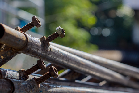 close-up Old Screw, bolt and nut Welded to a steel pipeの写真素材