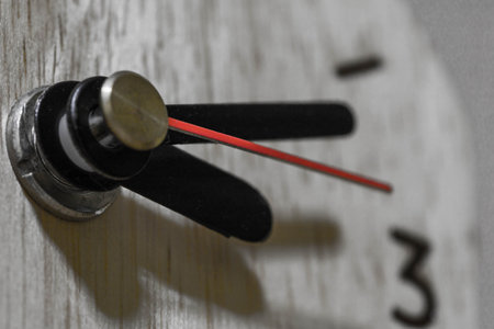 Close-up clockwise And numbers three on the Wood clock,texture. Abstract background