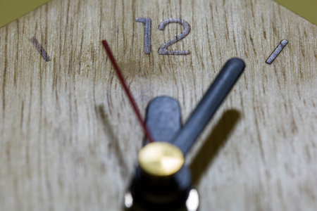 Close-up clockwise And numbers twelve on the Wood clock,texture. Abstract background