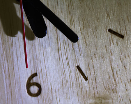 Close-up clockwise And numbers six on the Wood clock,texture. Abstract background