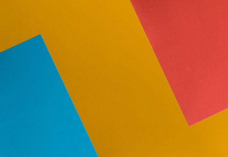 Colored paper in geometric flat.texture. Abstract background with copy space