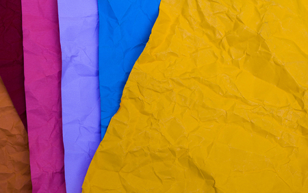 crumpled colour paper on with copy spaceの写真素材