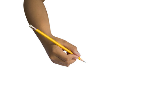 Close up hand of a female holding a Yellow Pencil isolated on white background with copy spaceの写真素材
