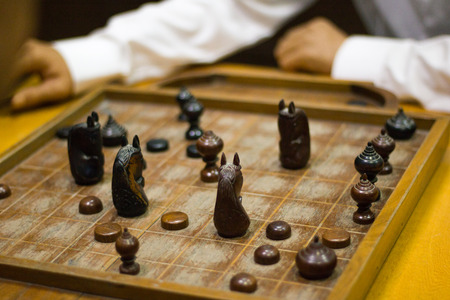 Old men playing chess on Chess boardの写真素材