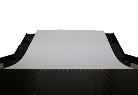 close-up white paper sheets on the printer in office on white backgroundの写真素材