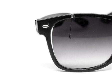 Close-up Broken Old Lens sunglasses Isolated On White Background with copy space.
