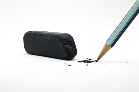 Old black Eraser and pencil on white backgroundの写真素材