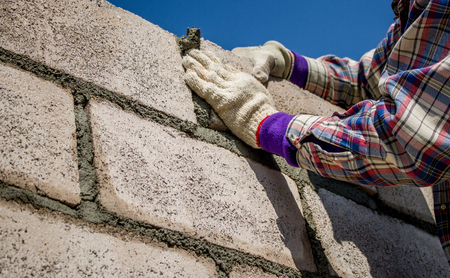 Technicians are working to build a brick wallの写真素材