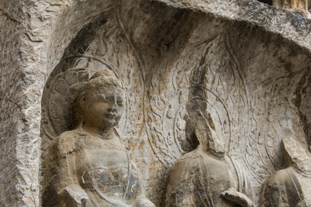 Close-up Stone Buddha Statue Carved from the mountainsの写真素材
