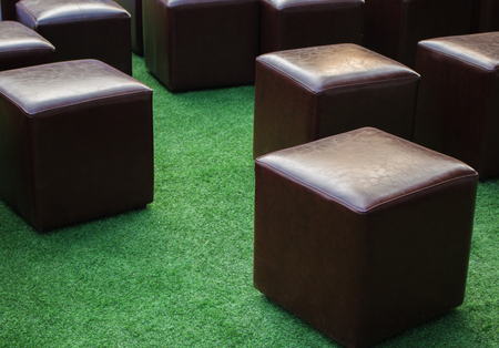 Close-up Brown Cube chair On the grass backgroundの写真素材