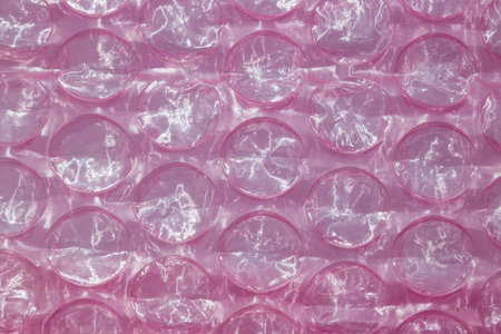 Close-up Pink Bubble Wrap Packing Or Air Cushion Film texture. Abstract background