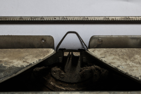 Close-up  Old typewriter rust and dust with paper sheet with copy spaceの写真素材