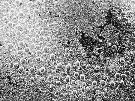 Abstract blur  steam bubbles at the bottom surface of the pan with boiling water Blurred background with copy spaceの写真素材