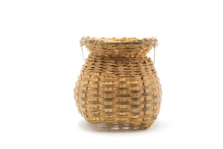Bamboo basket hand made  Used for putting various devices isolated on white background.