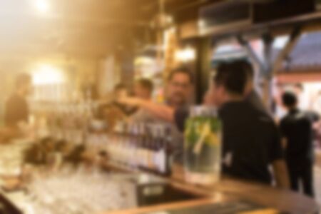 Abstract blur people enjoy at the bar pub and The atmosphere is party happy and relaxing,abstract blur backgroundの写真素材