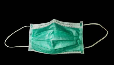 Protective face mask isolated on black  backgroundの写真素材