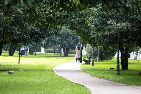 People walk along the paths of the park on a winter ,Abstract blur background.の写真素材