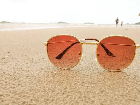 Close-up  sunglasses on the beach with copy spaceの写真素材