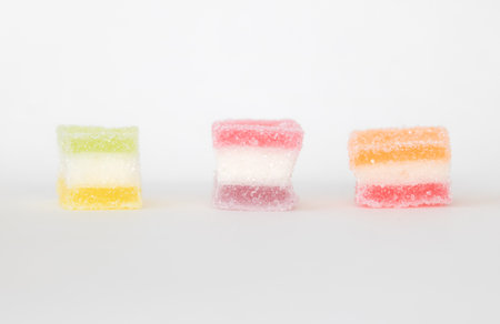 sugar coated jelly with beautiful colors on white background with copy spaceの写真素材