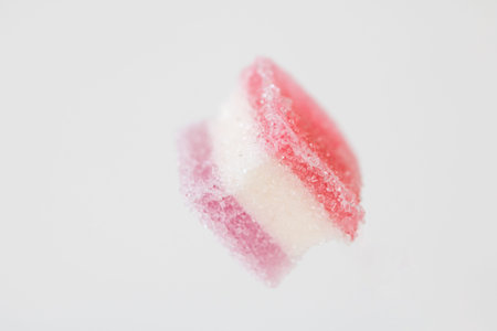 sugar coated jelly with beautiful colors on white background with copy spaceの写真素材