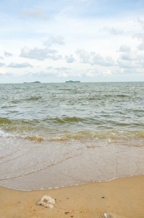 sand and sea wiht blue skyの写真素材